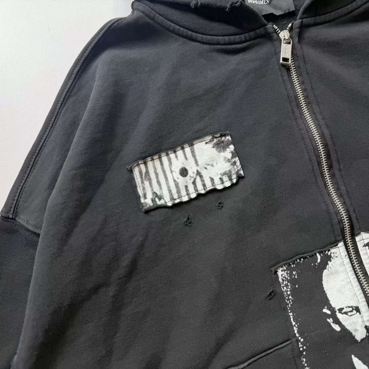 Distressed Patched Print Zip‑Up Hoodie