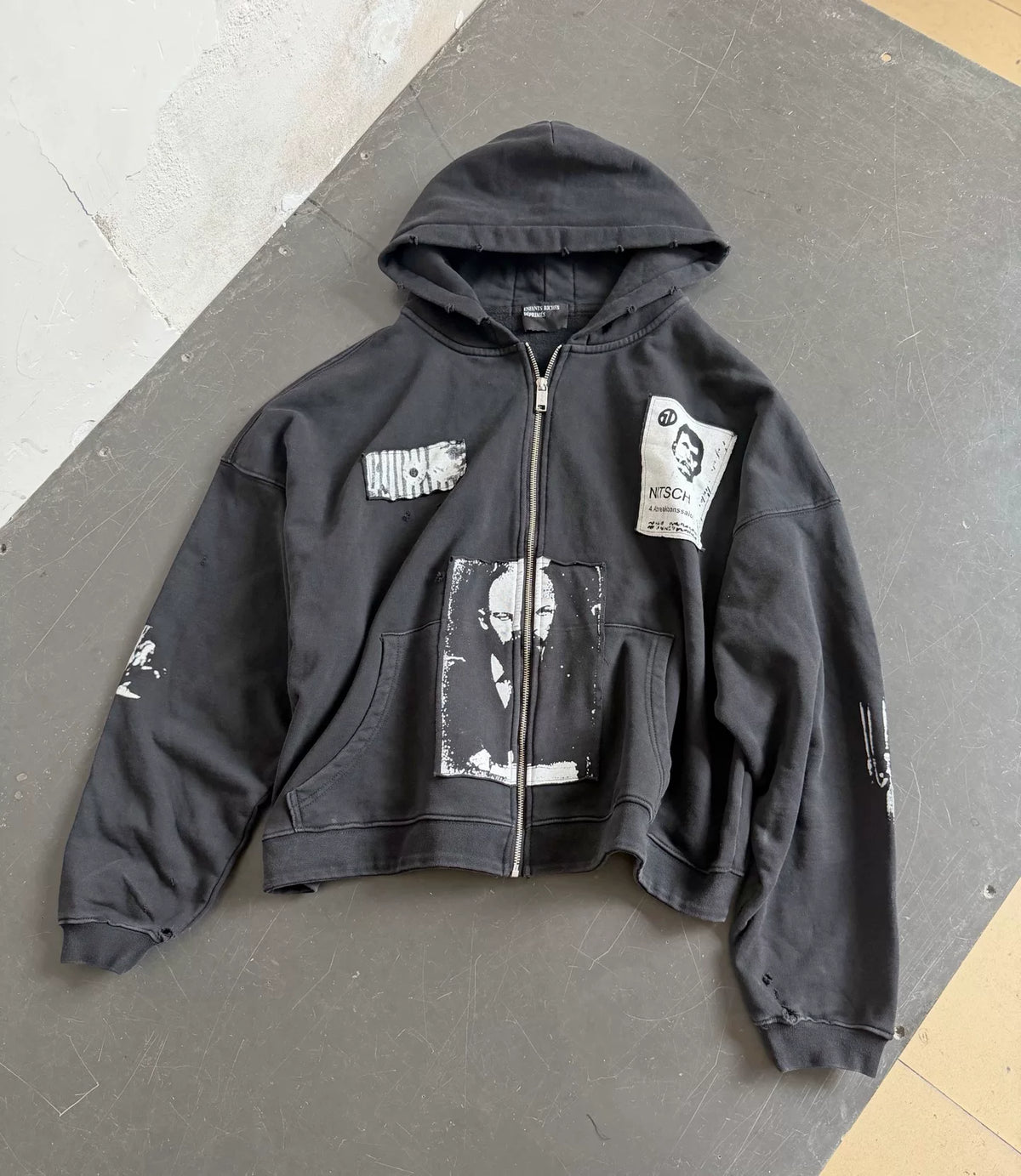 Distressed Patched Print Zip‑Up Hoodie